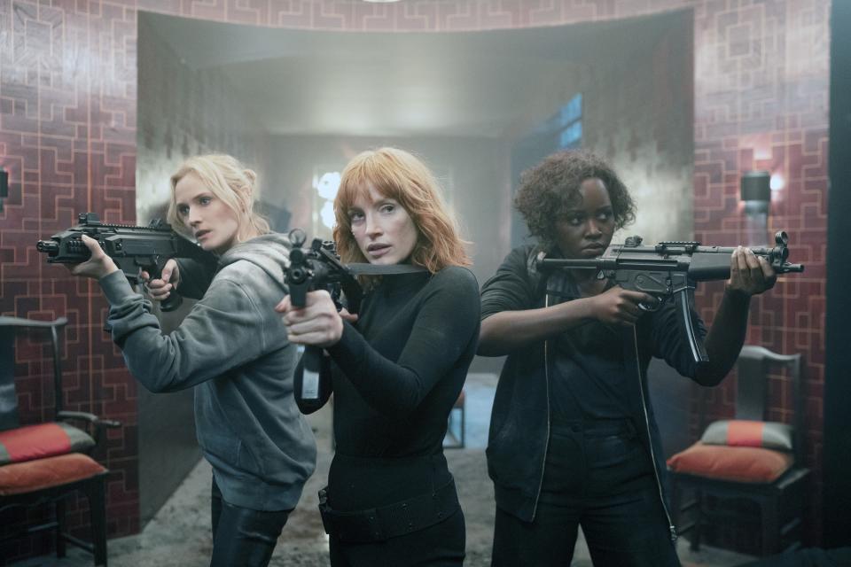 Diane Kruger, Jessica Chastain, and Lupita Nyong'o all hold machine guns