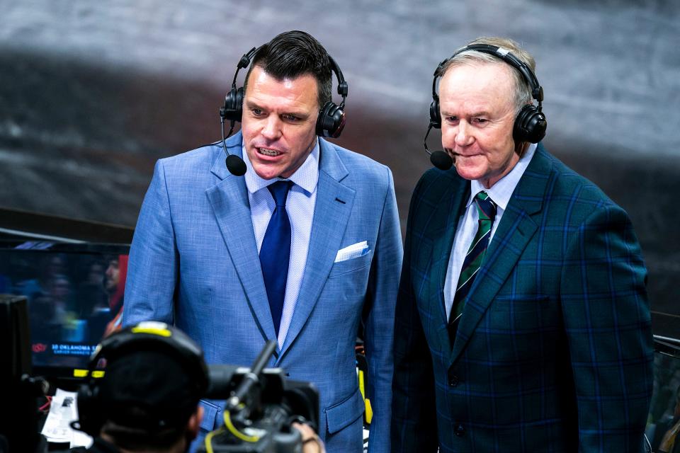 Big Ten Network's Shane Sparks, left, and Jim Gibbons do commentary during a NCAA college men's wrestling dual between Iowa and Oklahoma State earlier this season.