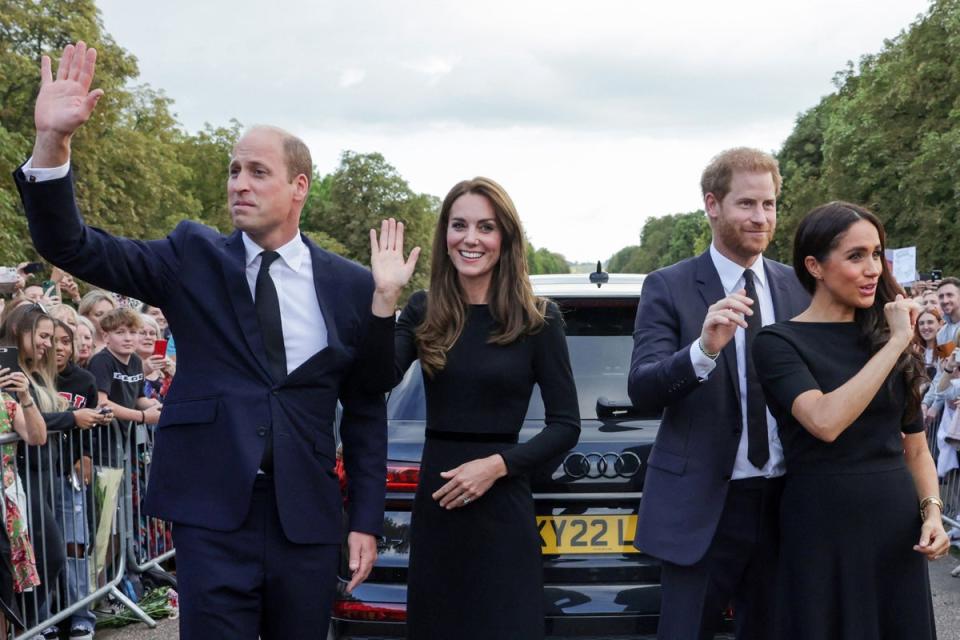 10 September 2022: Britain's Prince William, Prince of Wales, Britain's Catherine, Princess of Wales, Britain's Prince Harry, Duke of Sussex, Britain's Meghan, Duchess of Sussex, wave at well-wishers on the Long walk at Windsor Castle (AFP/Getty)