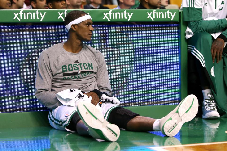 BOSTON, MA - NOVEMBER 14:  Rajon Rondo #9 of the Boston Celtics looks on from the bench against the Cleveland Cavaliers at TD Garden on November 14, 2014 in Boston, Massachusetts. NOTE TO USER: User expressly acknowledges and agrees that, by downloading and or using this photograph, User is consenting to the terms and conditions of the Getty Images License Agreement.  (Photo by Mike Lawrie/Getty Images)