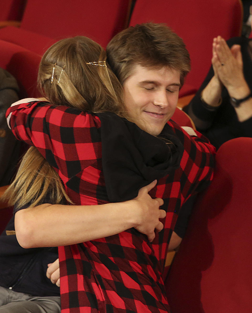 Tomasz Ritter of Poland is hugged by fellow contestant Aleksandra Swigut, as he is announced to be the winner of the 1st Chopin Competition on Period Instruments in Warsaw, Poland, Thursday, Sept. 13, 2018. The winner was announced after each of the six finalists played a Chopin concerto accompanied by the Amsterdam-based Orchestra of the 18th century. (AP Photo/Czarek Sokolowski)