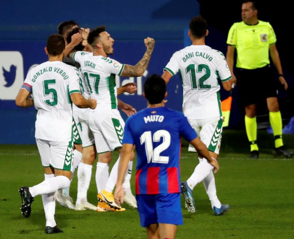 Elche’s players celebrate their 1-0 win against Eibar.