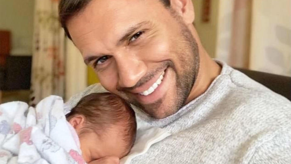 Pictured here, Josh Hill cuddles the baby daughter he had with fiancee Jo Duffy.