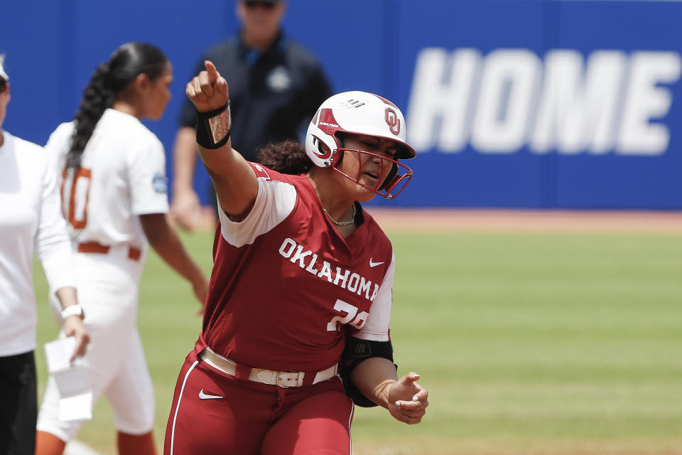 Oklahoma utility Jocelyn Alo (78) celebrates on the way to home plate after hitting a home run during the first inning of an NCAA Women's College World Series softball game against Texas on Saturday, June 4, 2022, in Oklahoma City. (AP Photo/Alonzo Adams)