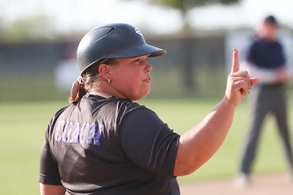 Mission Oak's Head Coach, Ilissa Fachinni, communicates to her team against Tulare Western in a West Yosemite high school softball game on Thursday, April 25th, 2024.