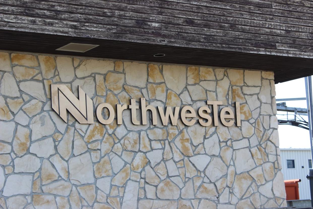 A Northwestel building in Norman Wells, N.W.T. in the summer of 2022. A spokesperson for the company says a 'perfect storm' knocked out internet, cell phone and landline service across parts of the North over the weekend. (Liny Lamberink/CBC - image credit)