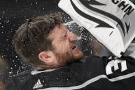 Los Angeles Kings goaltender Jonathan Quick sprays his face with water prior to Game 6 of an NHL hockey Stanley Cup first-round playoff series against the Edmonton Oilers Thursday, May 12, 2022, in Los Angeles. (AP Photo/Mark J. Terrill)