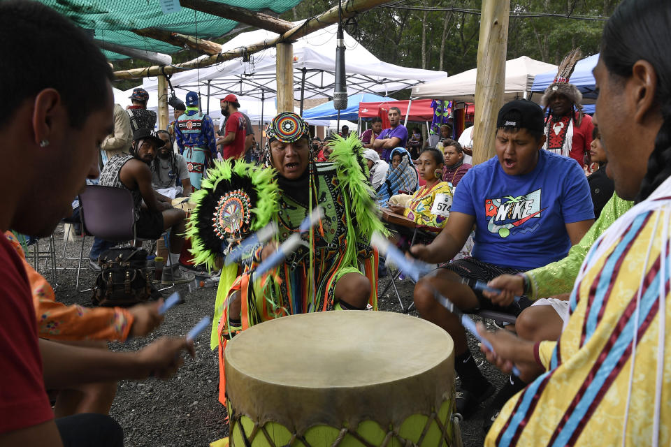 **HOLD FOR STORY BY SUSAN HAIGH** Drum group Ho-Chunk Station from Wisconsin perform during Schemitzun at the Mashantucket Pequot Tribal Nation, in Mashantucket, Conn., Wednesday, Aug. 28, 2021. (AP Photo/Jessica Hill)