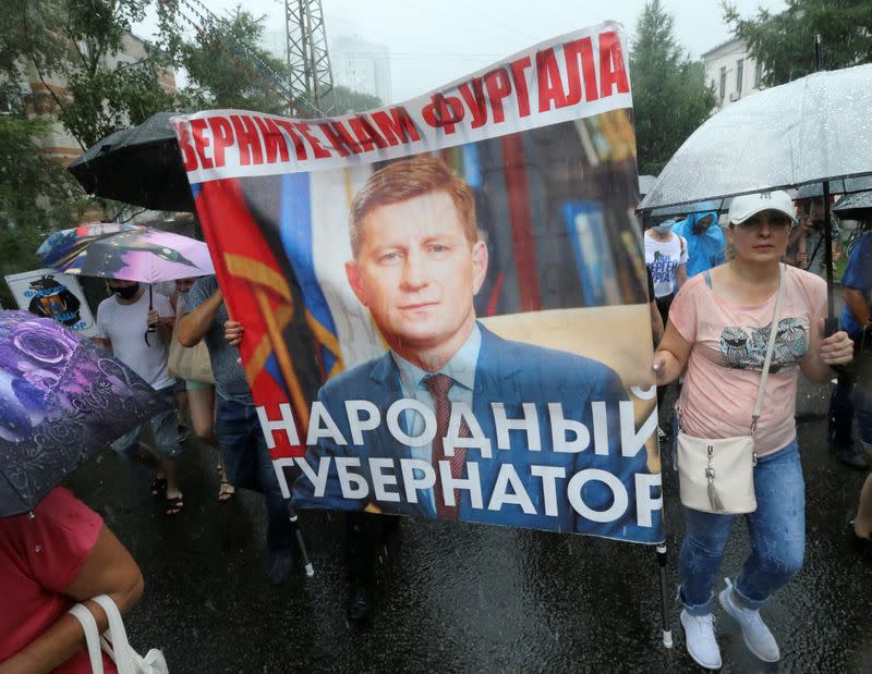 People take part in a rally in support of former regional governor Sergei Furgal in Khabarovsk