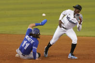 Toronto Blue Jays' Bo Bichette, left, steals second base as Miami Marlins second baseman Jazz Chisholm Jr., right, is late with the catch, during the sixth inning of a baseball game, Tuesday, June 22, 2021, in Miami. (AP Photo/Marta Lavandier)