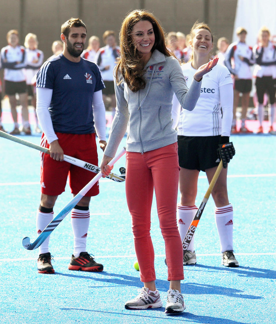 Britain's Duchess of Cambridge smiles as she plays hockey with the British Olympic hockey teams at the Riverside Arena in the Olympic Park, London, Thursday March 15, 2012. The Duchess of Cambridge viewed the Olympic Park and met members of the men's and women's British hockey teams. (AP Photo/Chris Jackson, Pool)