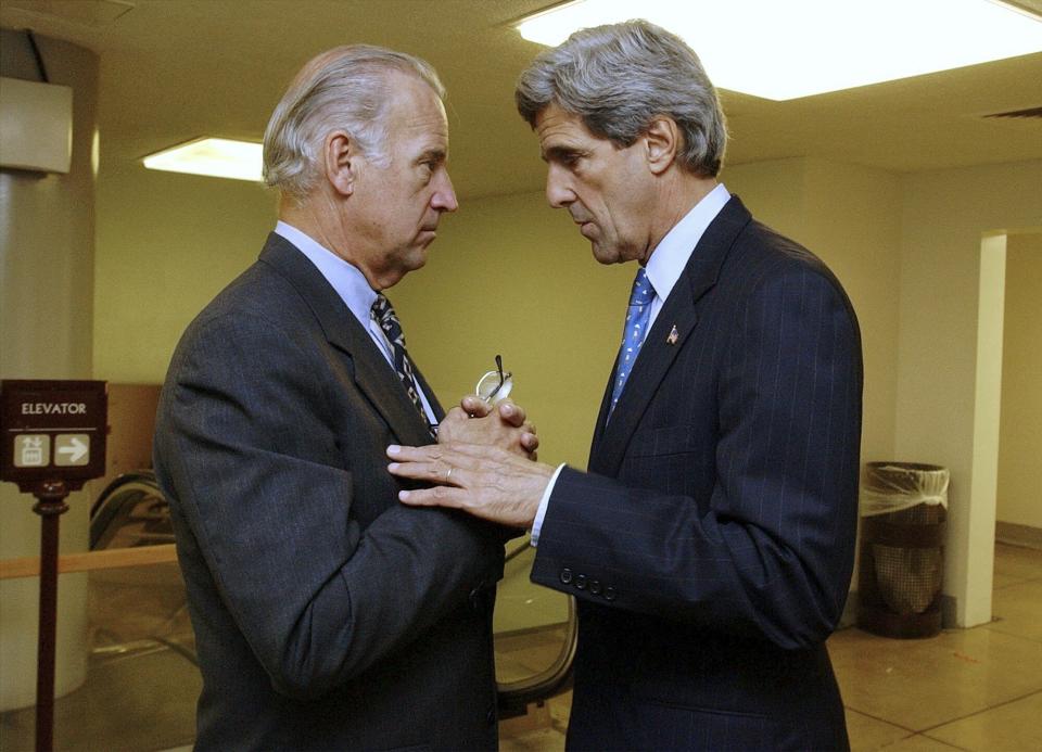 FILE - Sen. Joe Biden, left, D-Del., chairman of the Senate Foreign Relations Committee, and Sen. John Kerry, D-Mass., huddle in a Capitol corridor, Oct. 3, 2002. Biden stopped to talk about Iraq with Kerry en route to the Senate floor for a procedural vote, the last vote of the week and a step toward debate on an Iraq resolution. (AP Photo/Ken Lambert, File)