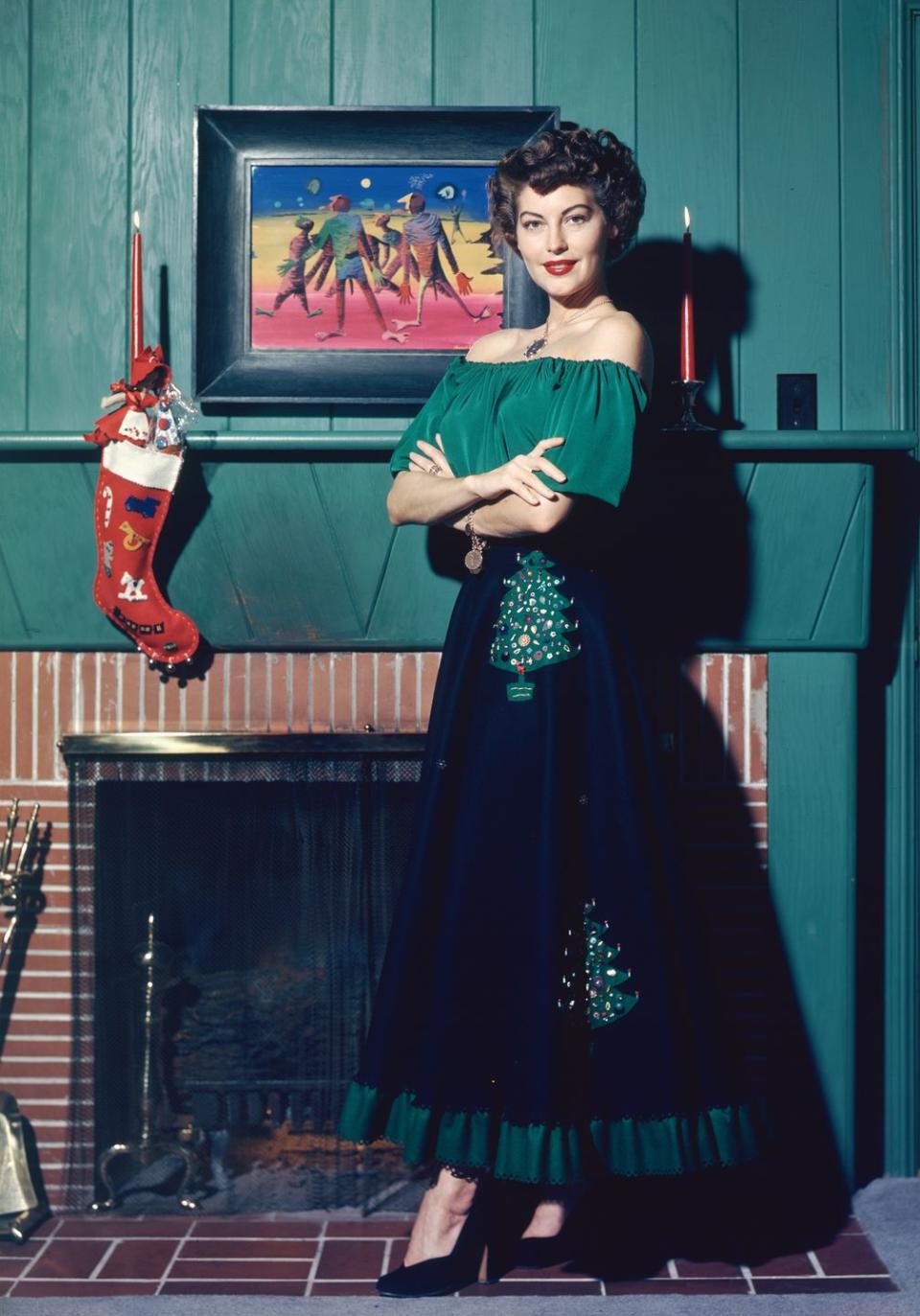 <p>Can we steal this look, Ava? The actress dressed in head-to-toe Christmas spirit as she poses near a stocking, hung by the chimney with care. </p>