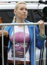 A supporter of the female punk band "Pussy Riot" stands outside a court building in Moscow, August 17, 2012.