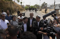 Israeli Knesset members Itamar Ben Gvir, center-right and Bezalel Smotrich, center left, speak to journalists during a visit to the Sheikh Jarrah neighborhood of East Jerusalem, Monday, May 10, 2021. Tensions have been fueled by the planned eviction of dozens of Palestinians from the Sheikh Jarrah neighborhood of east Jerusalem where Israeli settlers have waged a lengthy legal battle to take over properties. (AP Photo/Sebastian Scheiner)