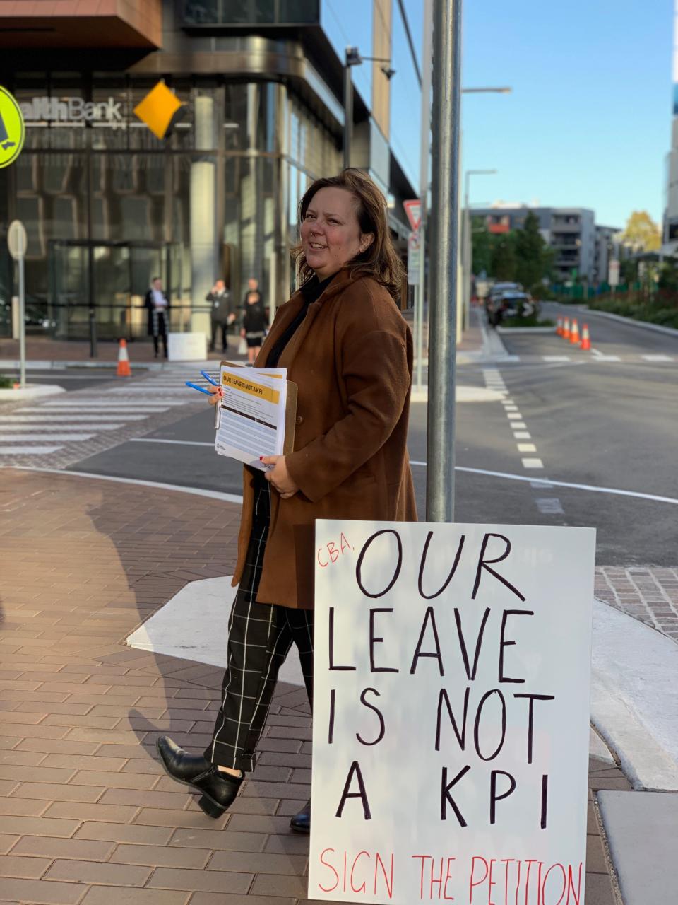 A CBA protestor with the sign: "Our leave is not a KPI".