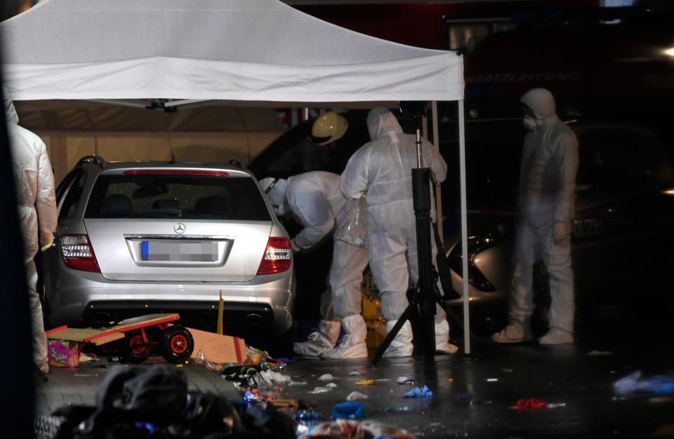 Police officers investigate the car of the man who drove into a carnival procession on February 24, 2020 in Volkmarsen near Kassel, central Germany. - Several people were injured when a car drove into a carnival procession in Volksmarsen, police said, adding that the driver had been arrested. (Photo by INA FASSBENDER / AFP) (Photo by INA FASSBENDER/AFP via Getty Images)