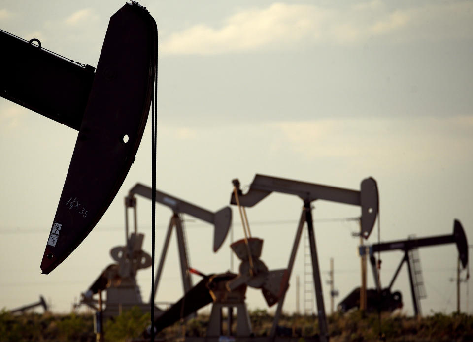 FILE - In this April 24, 2015 file photo, pumpjacks work in a field in the Permian Basin near Lovington, N.M. Environmentalists and Native American activists say the Biden administration's review of the federal oil and gas leasing program should result in more protections for an area of northwestern New Mexico that's considered sacred. They have cited concerns about air pollution from venting and flaring at natural gas collection and processing sites, wastewater leaks and unchecked development in southeastern New Mexico's share of the Permian Basin. (AP Photo/Charlie Riedel, File)