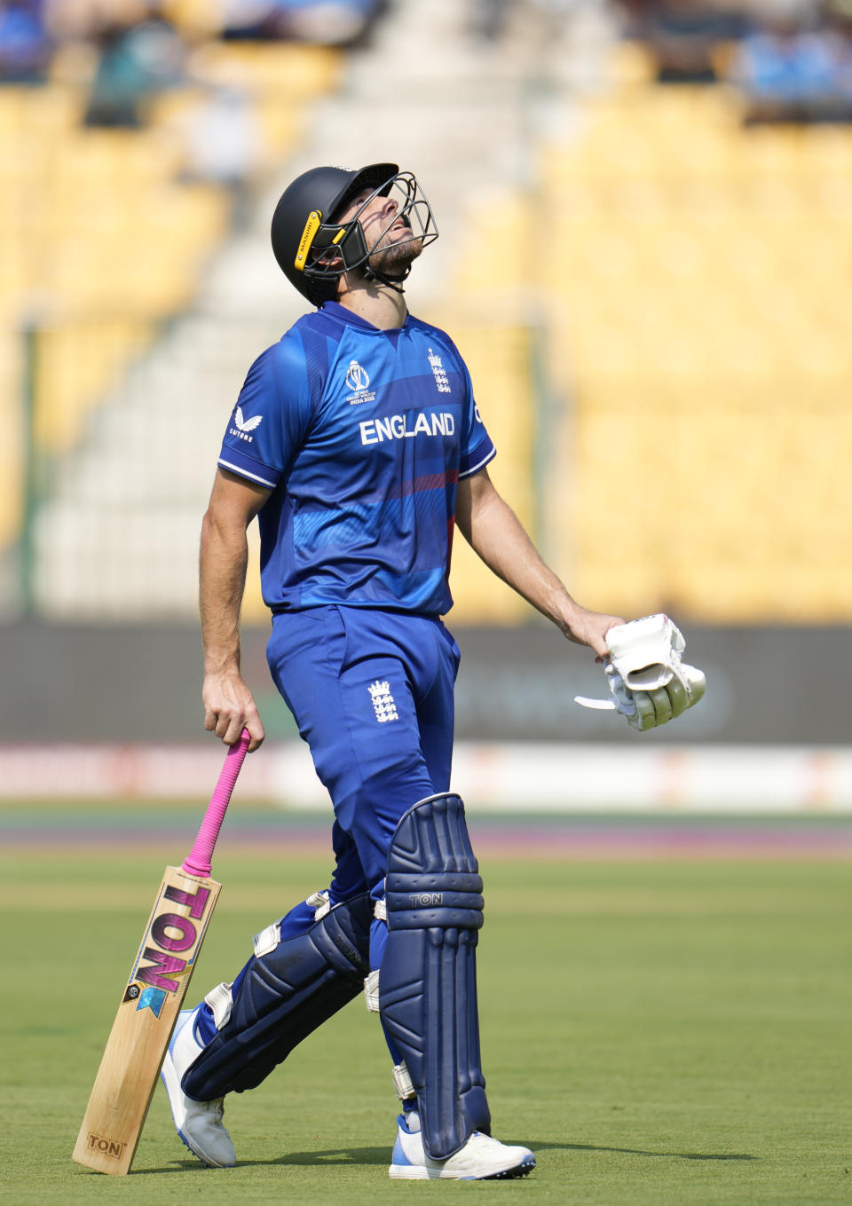 England's Dawid Malan leaves the ground after losing his wicket during the ICC Men's Cricket World Cup match between England and Sri Lanka in Bengaluru, India, Thursday, Oct. 26, 2023. (AP Photo/Aijaz Rahi)