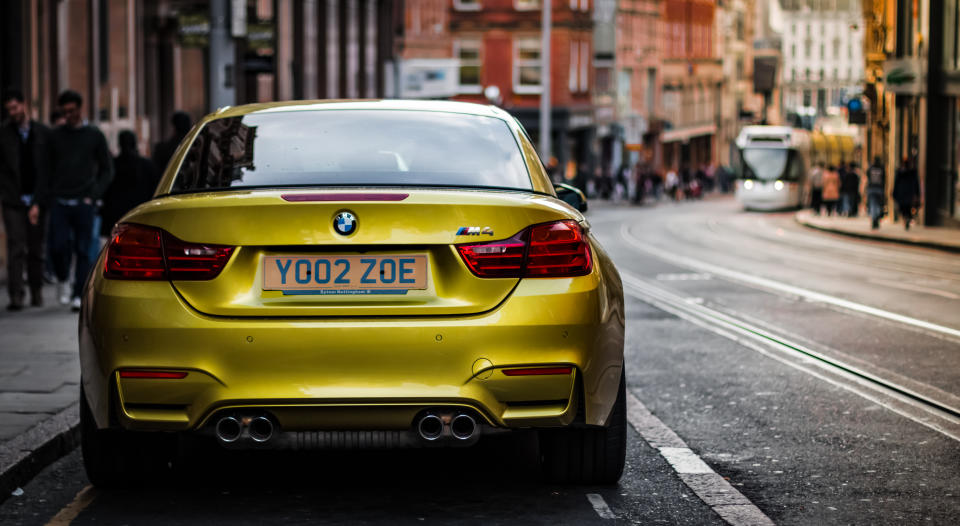 A modern BMW M4 parked in central Nottingham.