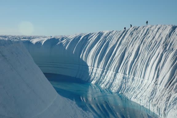 An ice canyon with ice melt flowing through.