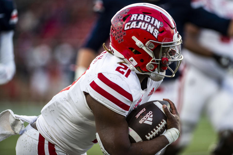 Louisiana-Lafayette running back Chris Smith (21) runs the ball against Liberty during an NCAA college football game, Saturday, Nov. 20, 2021, at Williams Stadium in Lynchburg, Va. (AP Photo/Kendall Warner)