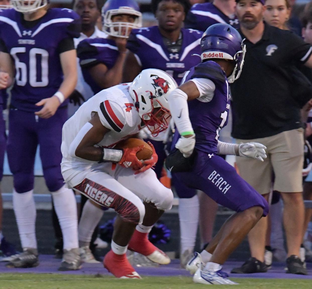 Jackson's Antwan Hart grabs the ball during a September game against Fletcher. Jackson is on the Class 2M playoff bubble, while Fletcher has a chance to clinch its playoff berth if they defeat First Coast on Thursday.
