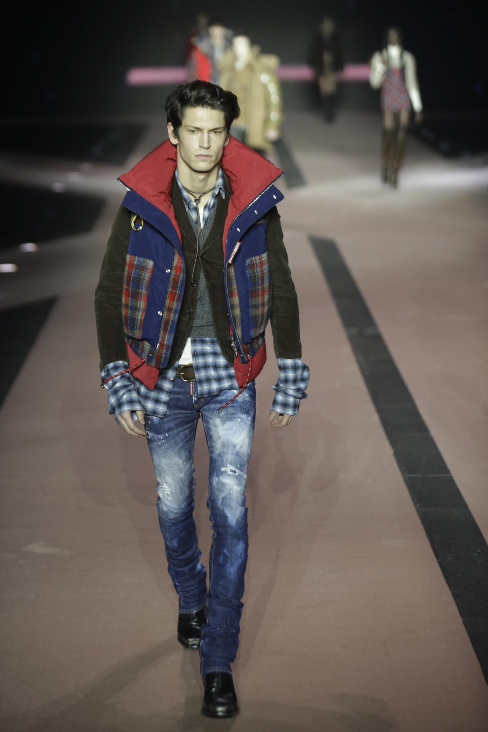 A model wears a creation as part of the Dsquared2 men's Fall-Winter 2020/21 collection, that was presented in Milan, Italy, Friday, Jan. 10, 2019. (AP Photo/Luca Bruno)