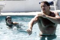 <p>Arnold Schwarzenegger swims with his then-girlfriend Maria Shriver in L.A. in 1979. </p>