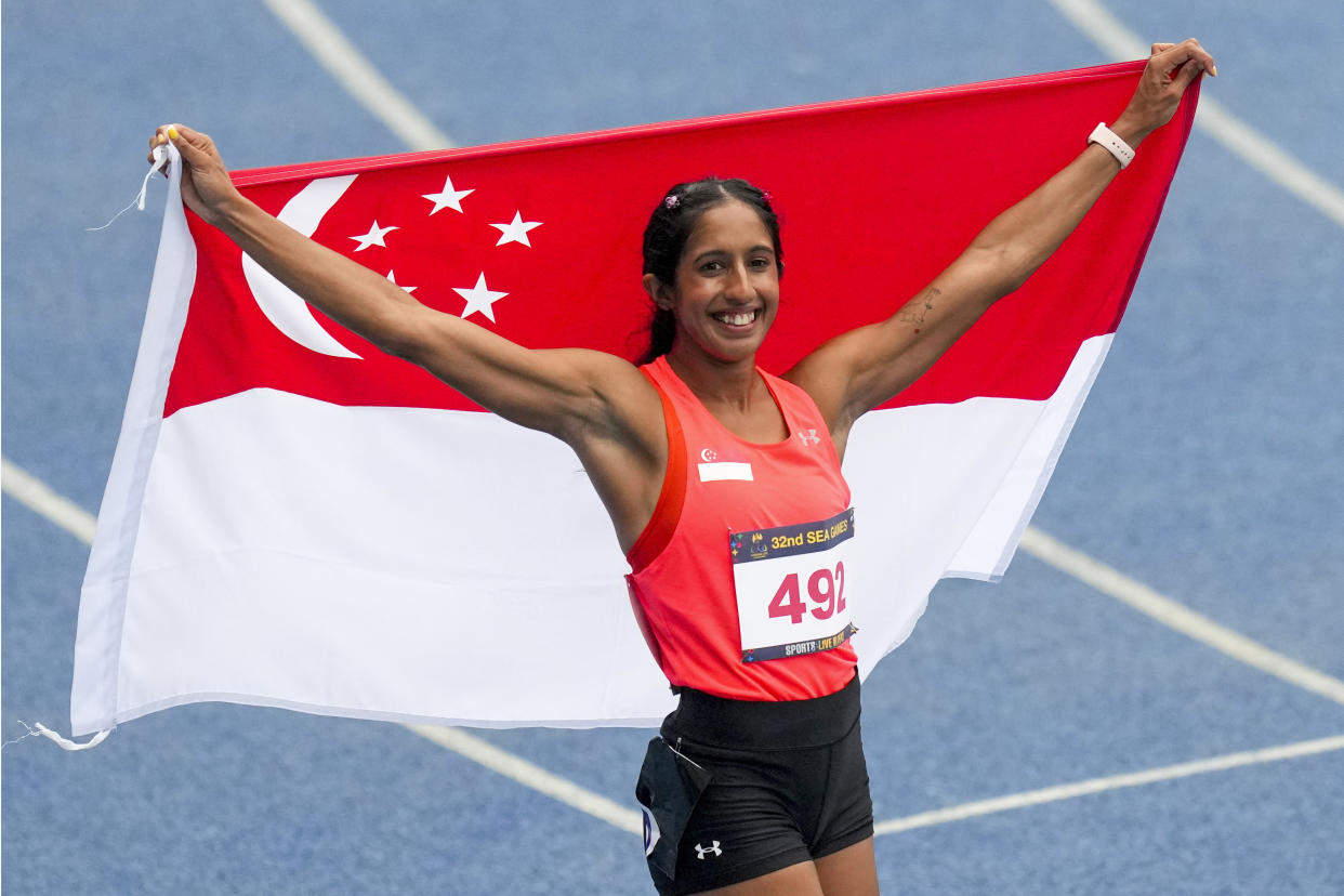 Singapore sprinter Shanti Pereira celebrates after winning in the women's 100m final at the 2023 SEA Games in Cambodia. 