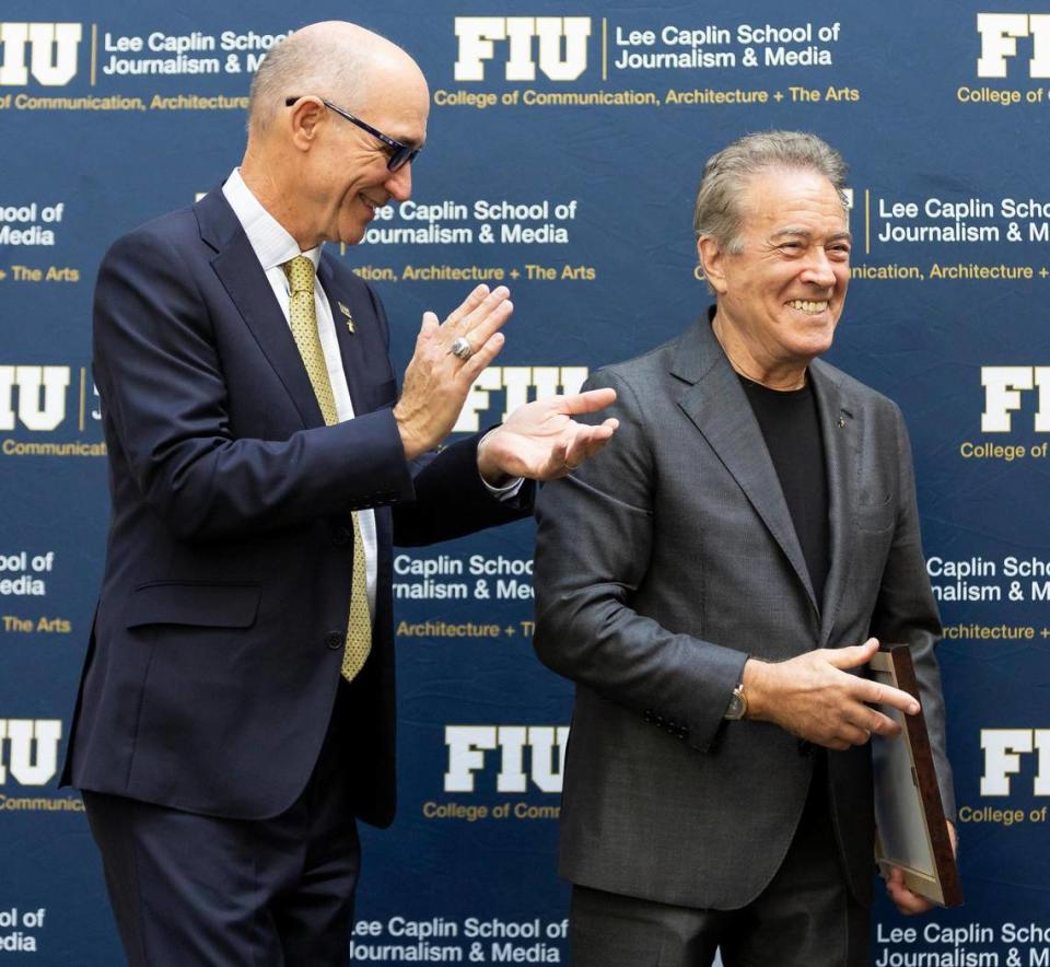 Florida International University President Kenneth A. Jessell, left, reacts while on stage with Lee Caplin during a ribbon-cutting ceremony at FIU’s Biscayne Bay Campus on Friday, Nov. 17, 2023, in North Miami, Fla. The ceremony was held to officially unveil the Lee Caplin School of Journalism & Media, the iSTAR Volumetric Capture Studio and the Sam Moore: The Legendary Soul Man Theatre.