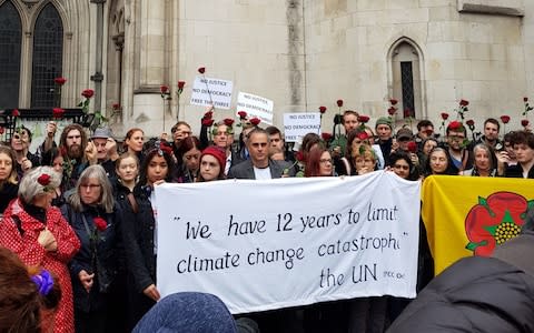 Protestors outside the Royal Court of Justice, - Credit: Cathy Gordon /PA