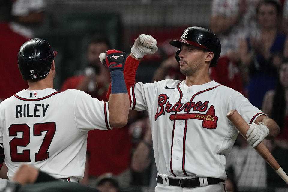 Atlanta Braves' Austin Riley (27) celebrates with Matt Olson after hitting a home run in the seventh inning of a baseball game against the St. Louis Cardinals Wednesday, Sept. 6, 2023, in Atlanta. (AP Photo/John Bazemore)