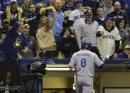 Fans scream after Los Angeles Dodgers' Manny Machado struck out during the first inning of Game 6 of the National League Championship Series baseball game against the Milwaukee Brewers Friday, Oct. 19, 2018, in Milwaukee. (AP Photo/Matt Slocum)