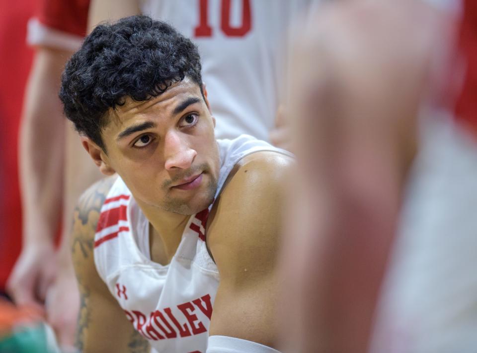 Bradley's Ja'Shon Henry listens to his coaches during a timeout as the Braves battle St. Joseph on Saturday, Dec. 18, 2021 at Carver Arena.