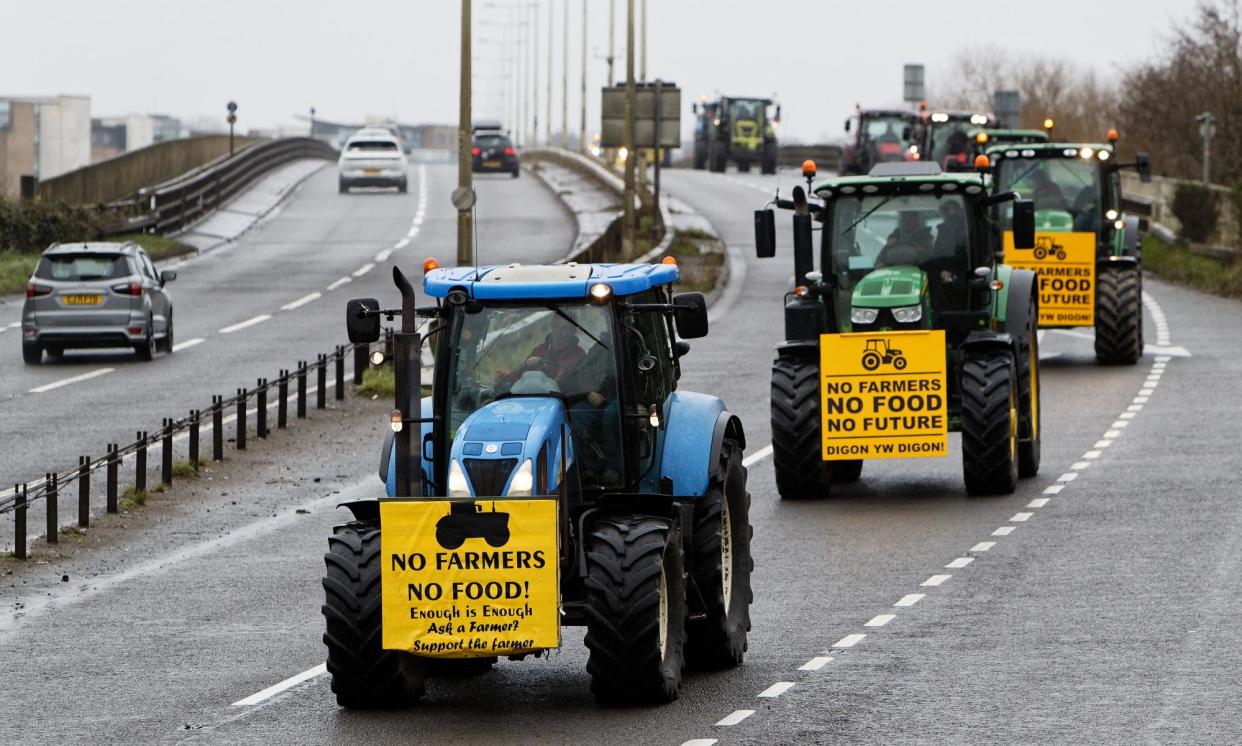 <span>Farmers travel to a demonstration against a number of the Welsh government’s rural policies.</span><span>Photograph: Dimitris Legakis/Athena/The Guardian</span>