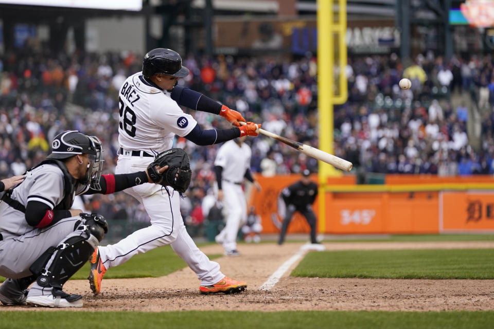 Detroit Tigers' Javier Baez connects for a walk-off single to right field during the ninth inning of a baseball game against the Chicago White Sox, Friday, April 8, 2022, in Detroit. (AP Photo/Carlos Osorio)