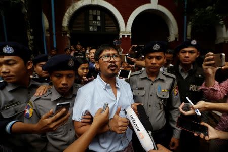 Detained Reuters journalist Wa Lone speaks to the media while leaving Insein court in Yangon, Myanmar July 9, 2018. REUTERS/Ann Wang