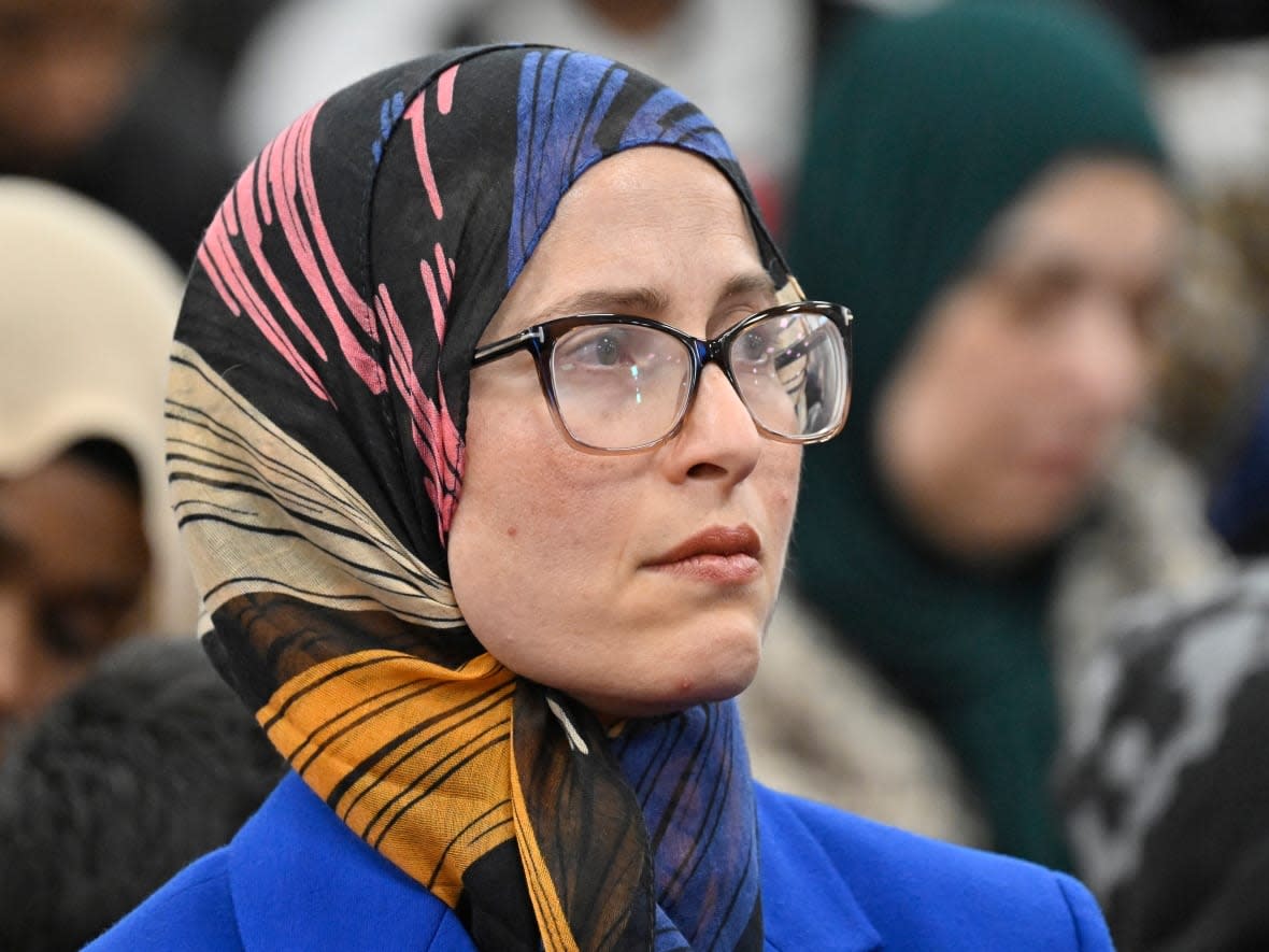 Amira Elghawaby looks on during a ceremony marking the sixth anniversary of the fatal mosque shooting on Jan. 29 at the mosque in Quebec City. Elghawaby was nominated by the federal government as special representative on combating Islamophobia.  (Jacques Boissinot/The Canadian Press - image credit)