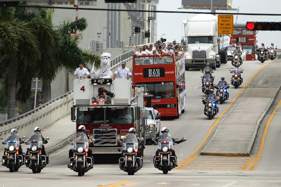 MIAMI, FL - JUNE 25: Miami Heat players, coaches and supporters are seen as they arrive on double decker buses for the start of a victory parade through the streets during a celebration for the 2012 NBA Champion Miami Heat on June 25, 2012 in Miami, Florida. The Heat beat the Oklahoma Thunder to win the NBA title. (Photo by Joe Raedle/Getty Images)