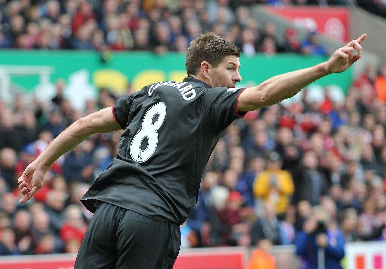 Liverpool's English midfielder Steven Gerrard celebrates scoring their first goal during the English Premier League football match between Stoke City and Liverpool in Stoke-on-Trent, central England on May 24, 2015