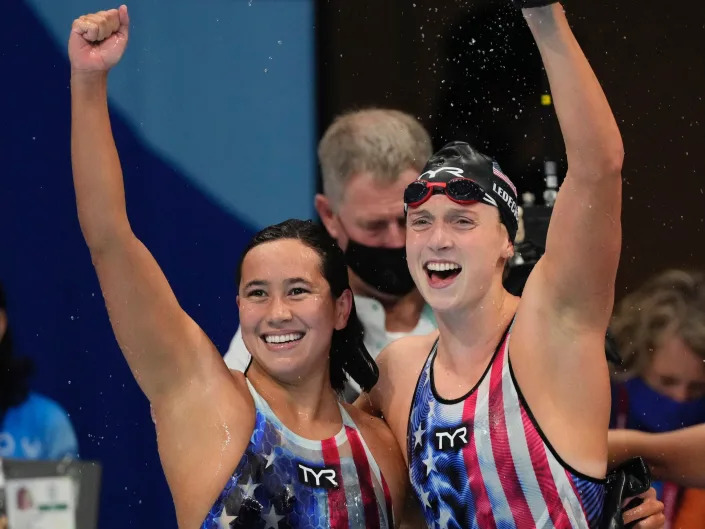 Sullivan (left) and Katie Ledecky celebrate their 1500-meter freestyle finishes at the Tokyo Olympics.