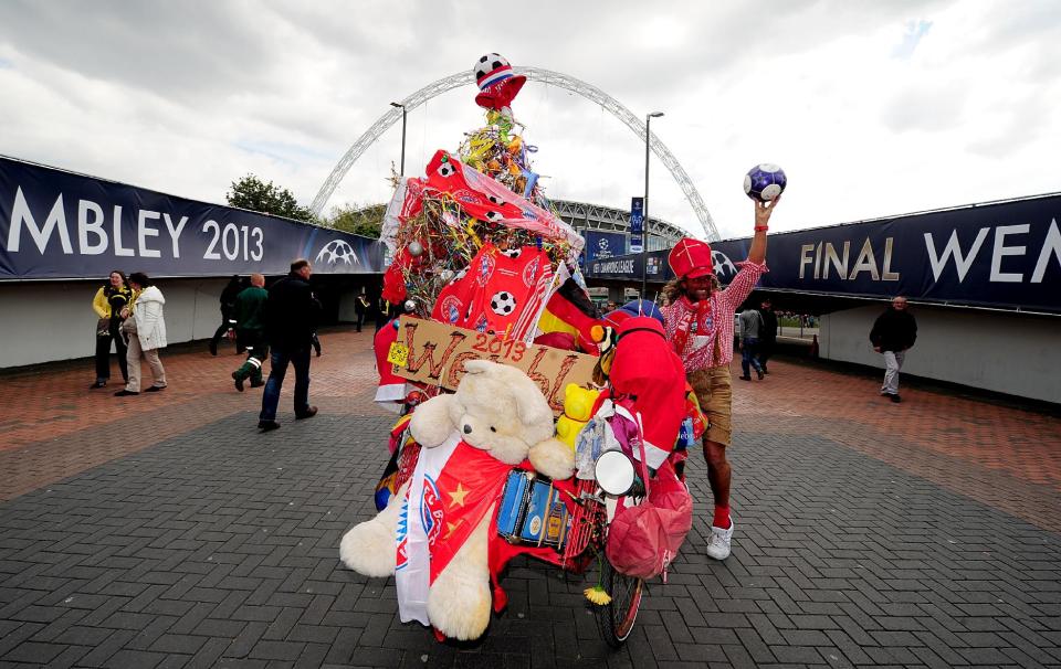 A Bayern Munich fan and his wacky and wonderful wonder bicycle outside Webley Stadium before the game.