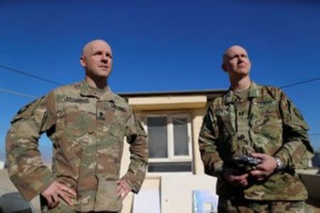 US. army soldiers stand during an interview with Reuters in the town of Bartella, east of Mosul, Iraq, December 27, 2016. Picture taken December 27, 2016. REUTERS/Ammar Awad