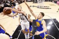 May 22, 2017; San Antonio, TX, USA; San Antonio Spurs shooting guard Manu Ginobili (20) grabs a rebound as Golden State Warriors shooting guard Klay Thompson (11) defends during the second half in game four of the Western conference finals of the NBA Playoffs at AT&T Center. Mandatory Credit: Soobum Im-USA TODAY Sports