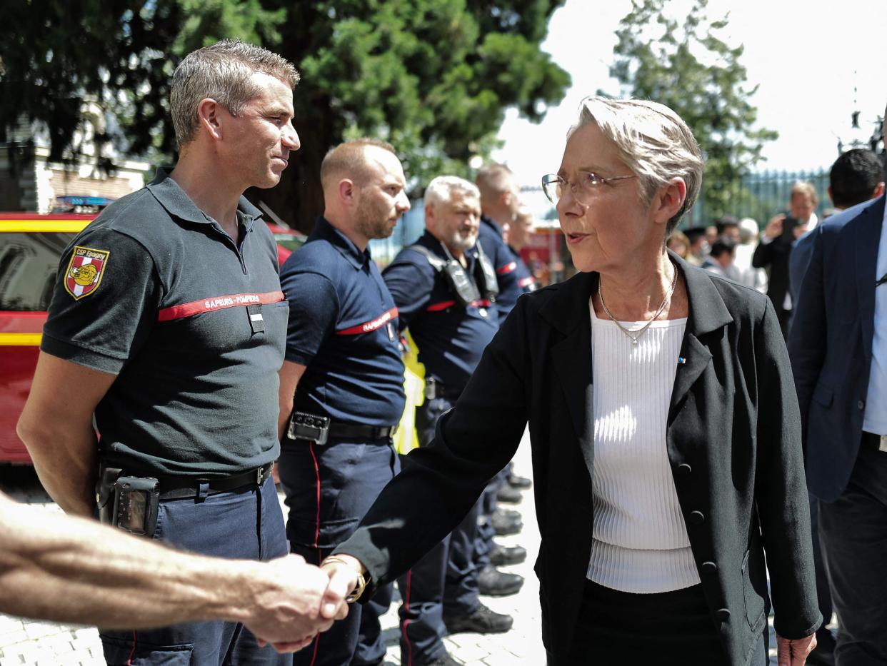 French Prime Minister Elisabeth Borne meets emergency workers (AFP via Getty Images)