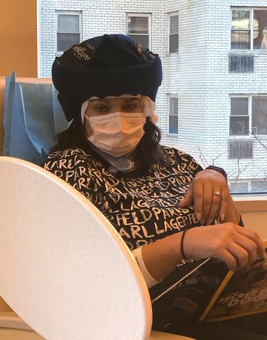 <p>Sara Sidner</p> Sara Sidner receives treatment for breast cancer, wearing a freeze cap to help prevent hair loss