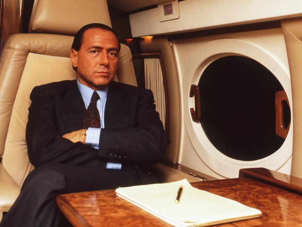 Silvio Berlusconi on his private jet flying from Rome to Milan in 1987 (Getty)