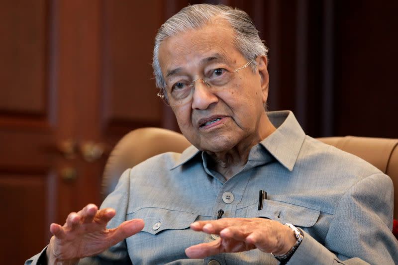 Malaysia's former PM Mahathir speaks during an interview in Kuala Lumpur