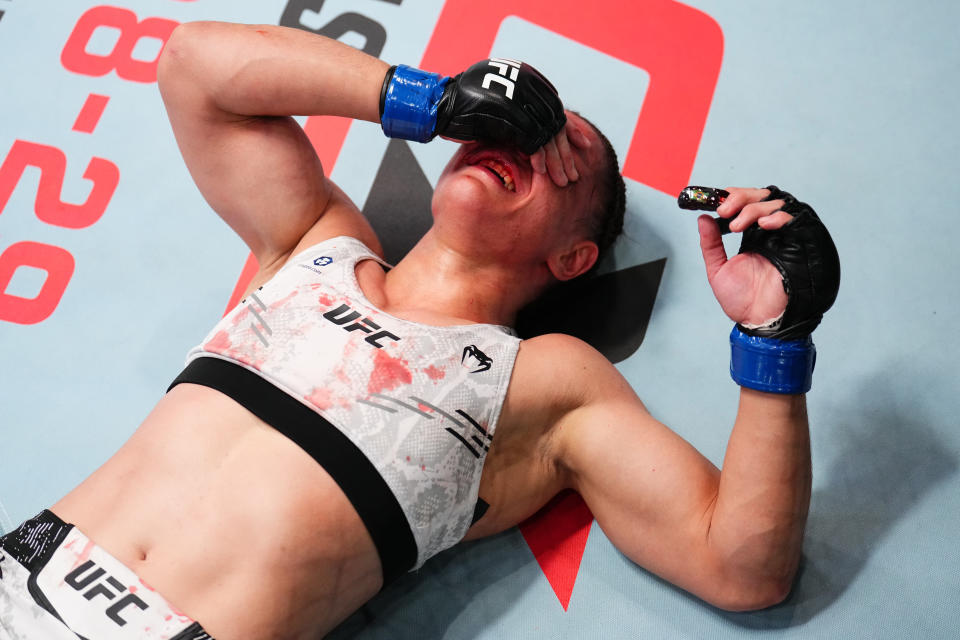 LAS VEGAS, NEVADA - MAY 18: Ariane Carnelossi of Brazil reacts after receiving a headbutt from opponent Piera Rodriguez of Venezuela in a strawweight fight during the UFC Fight Night event at UFC APEX on May 18, 2024 in Las Vegas, Nevada.  (Photo by Chris Unger/Zuffa LLC via Getty Images)